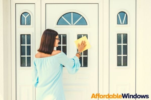 woman cleaning composite door